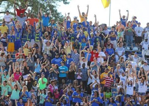 fans cheer on aluminum bleachers